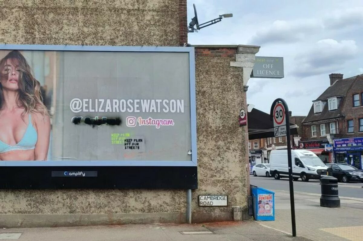 The ASA has found that OOHs depicting OnlyFans model, Eliza Rose Watson, half-dressed were not 'in breach' of advertising guidelines, here showing the advert being graffitied 